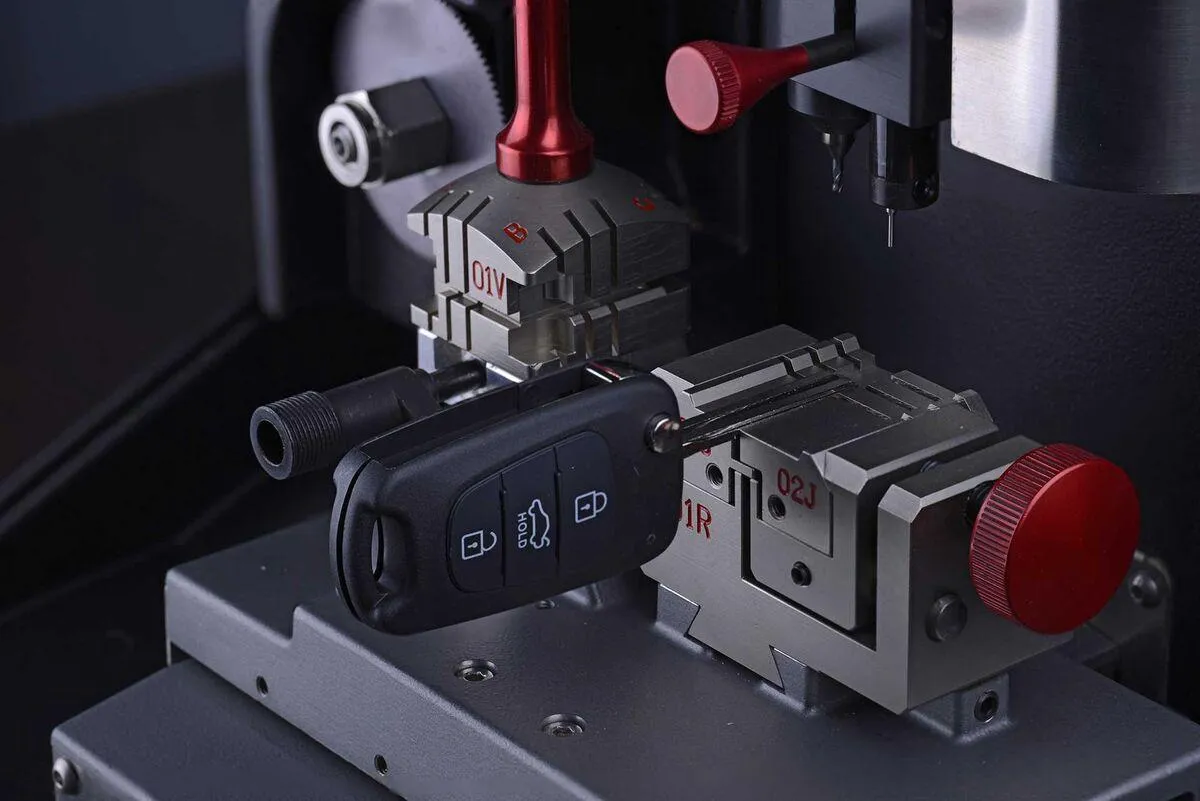 Car key replacement being programmed by Auto Access auto locksmith in Durham