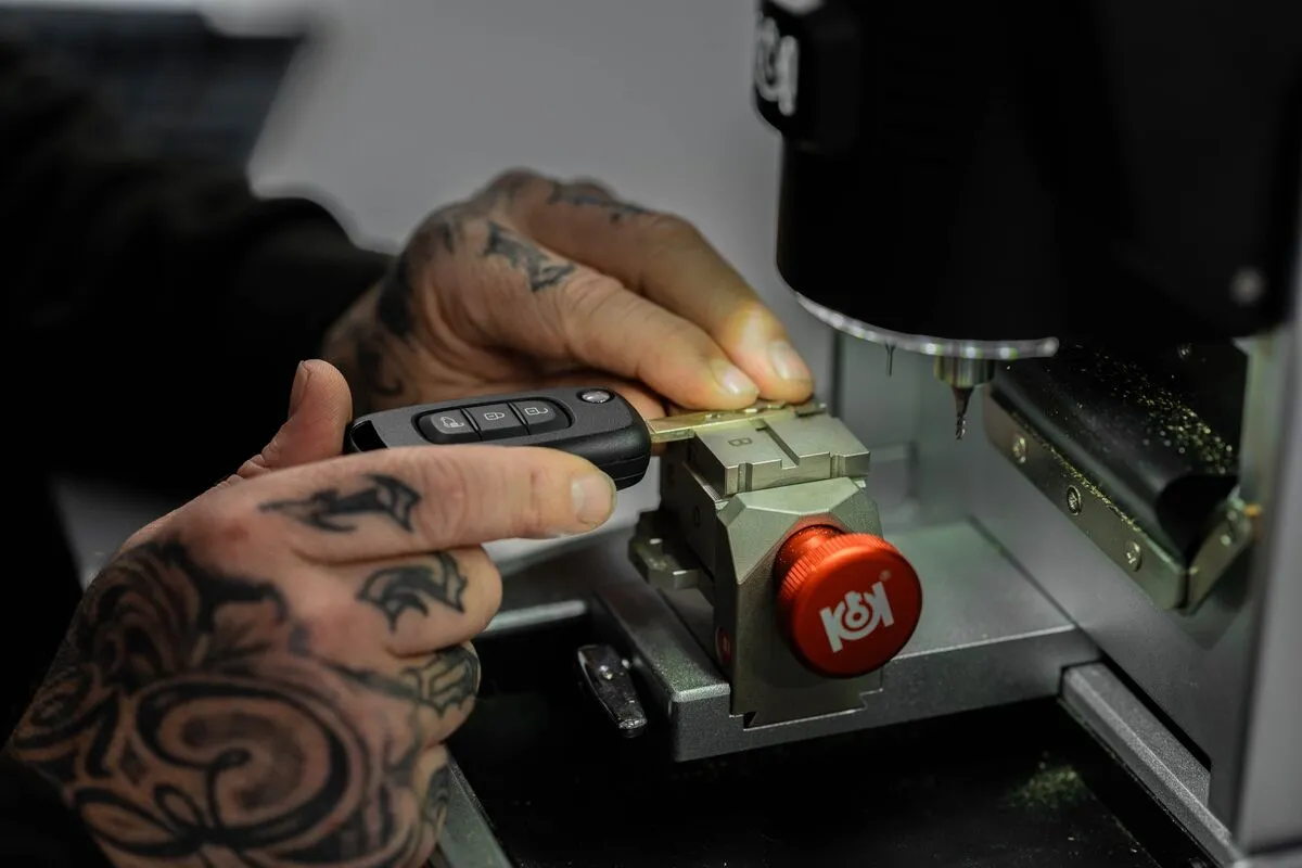 Car key being cut on a professional key cutting machine